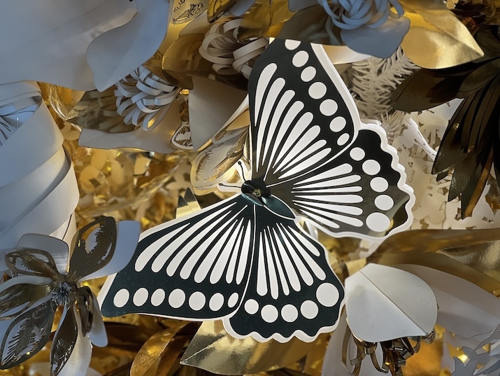 An example of laser cutting for high-end retail shops - a gold butterfly on Dior's Christmas display