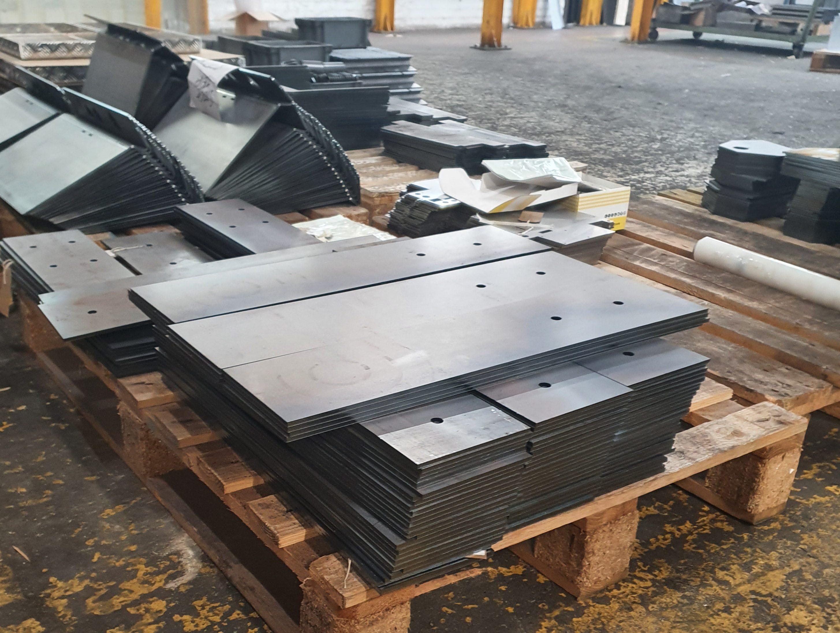 Steel legs of the bench cut by Bystar industrial laser cutter are assembled at Laser Expertise.